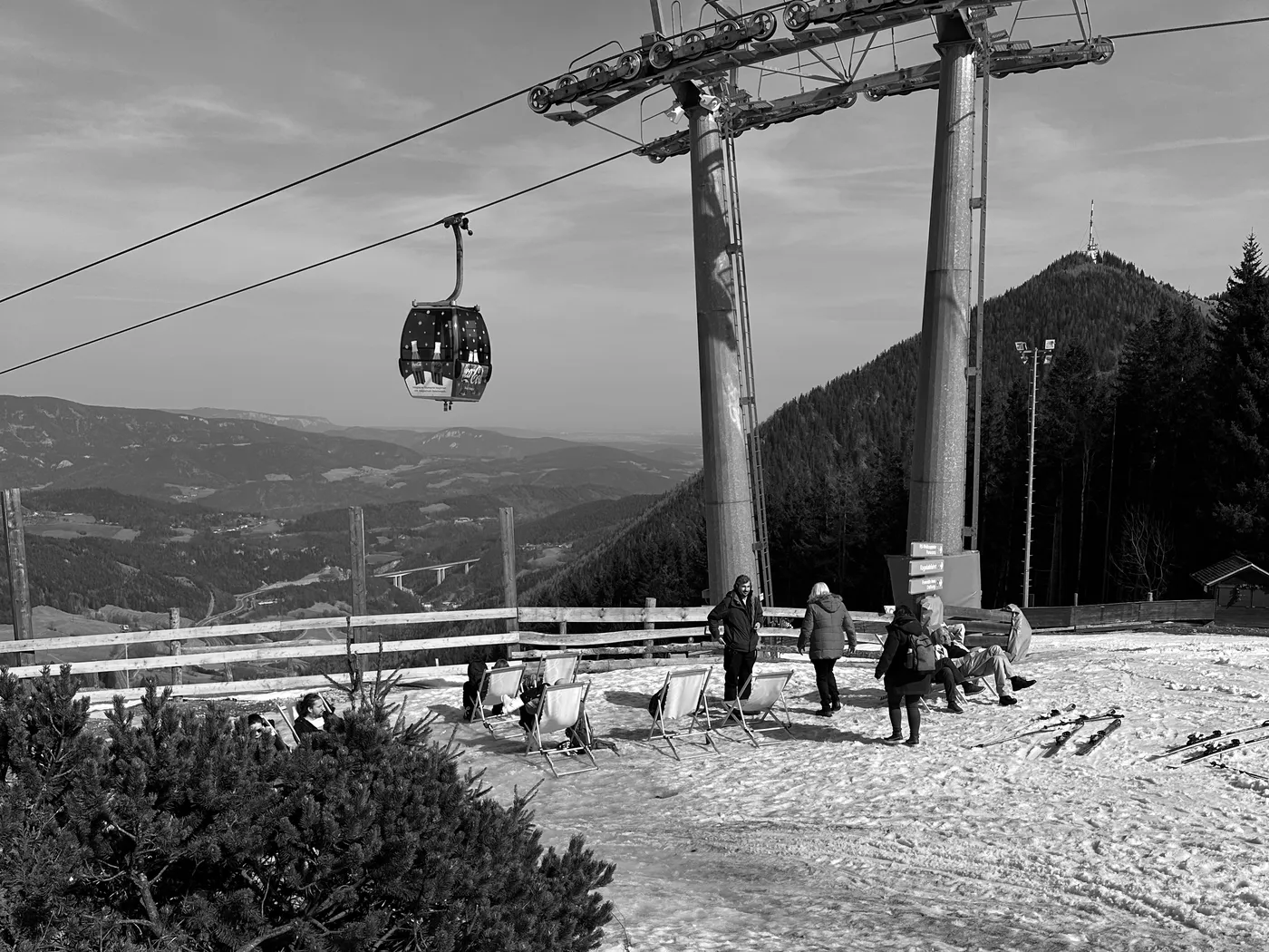 Skiers waiting at the chairlift on a winter morning