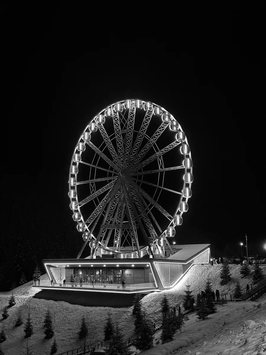 The illuminated Ferris wheel at Bukovel at night